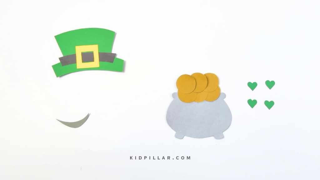 Paste the coins on the Pot of Gold cutout