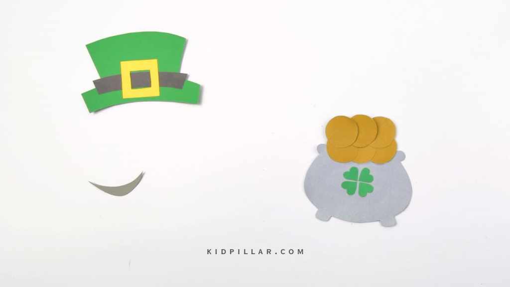 Make clover shape by pasting heart cutouts on pot of gold craft for preschoolers