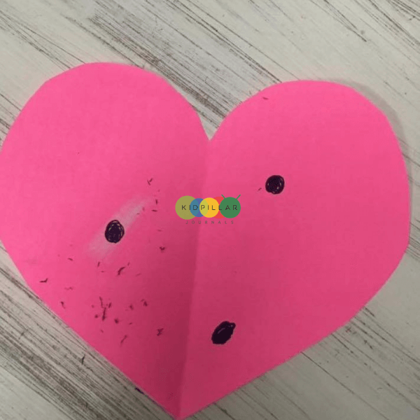 pink paper heart for meaningful Valentine activities for kids